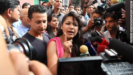 Sobhraj&#39;s wife, Nihita Biswas, speaks with media outside the Supreme Court in Kathmandu on July 30, 2010. 