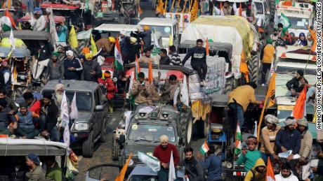 Farmers protest during a tractor rally near the Singhu border crossing in New Delhi, India, on January 26, 2021. 