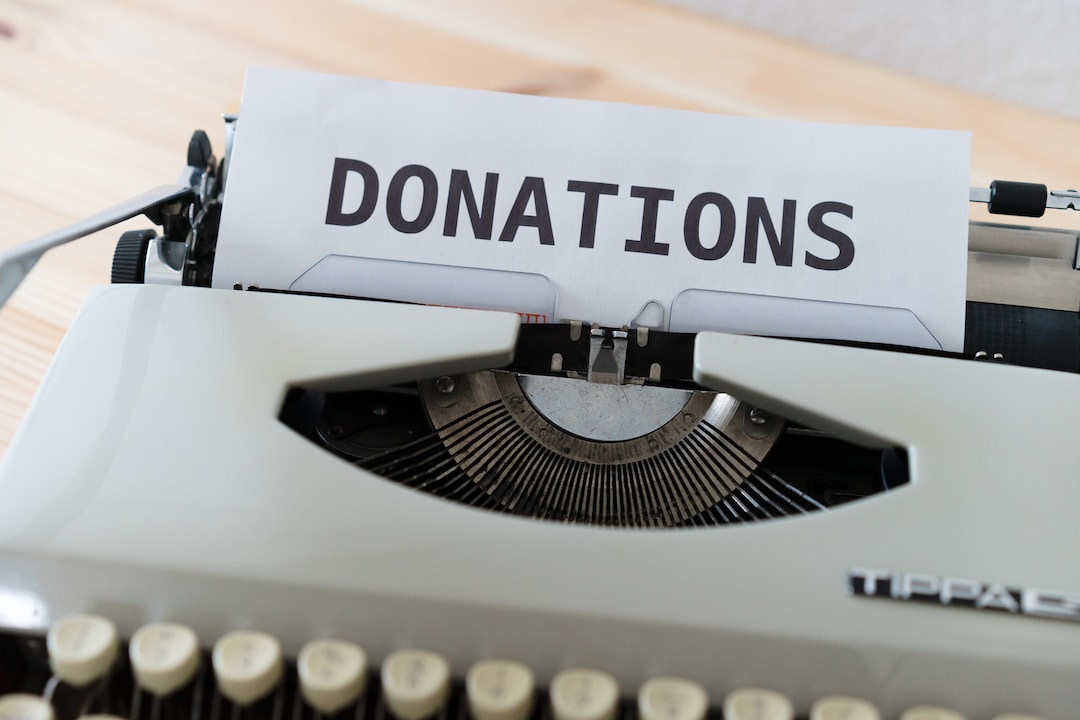 A typewriter writes "Donations".